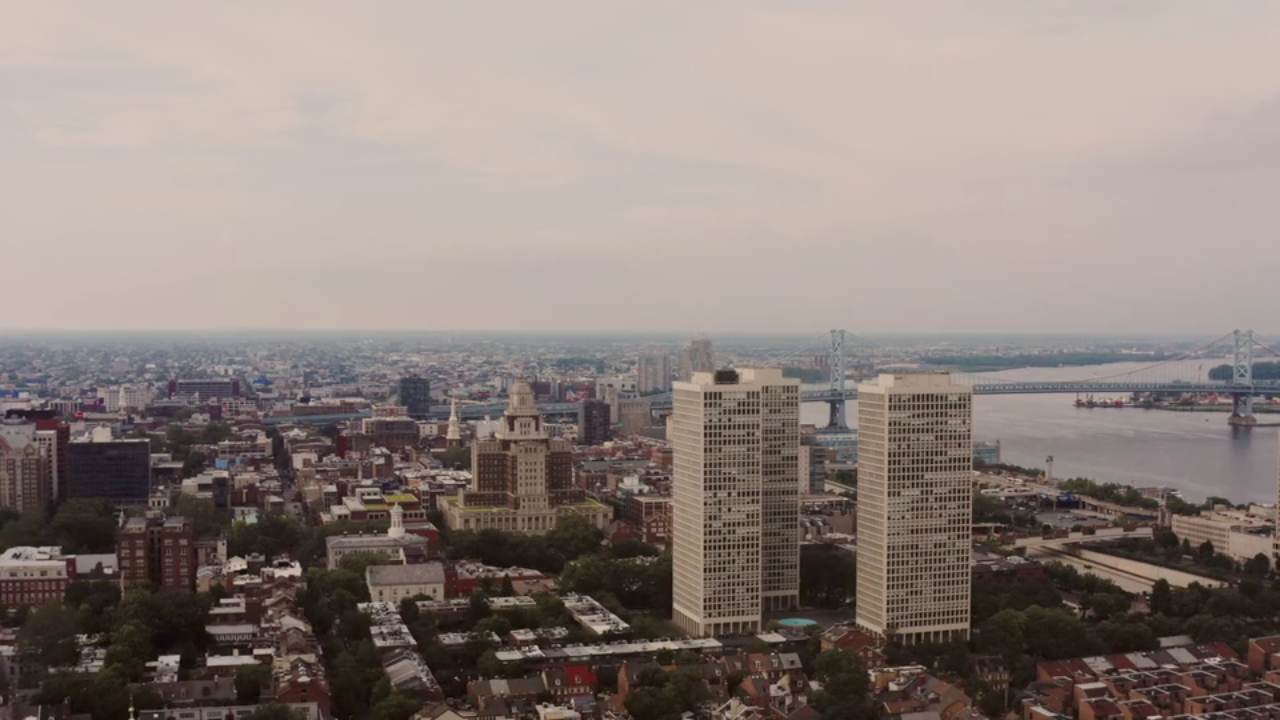 An aerial view of a city skyline and riverfront